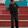 oversized-t-shirt-mockup-of-a-cheerful-man-standing-by-the-street