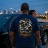 Pisces Shirt, Dolphin Shark Tee, Zodiac Graphic Shirt, Astrology – man wearing the graphic tee next to a truck