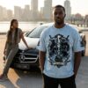 BLACK ICE HOCKEY EST. 1885 tee – close-up of man wearing the tee next to a Mercedes-Benz